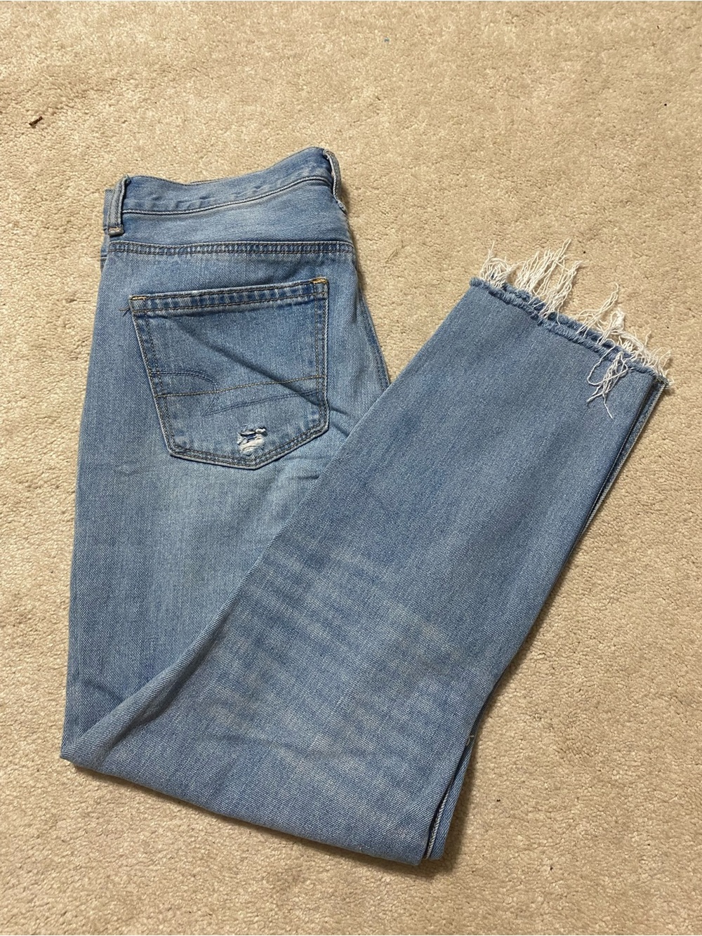 American Eagle Frayed Hem Ankle Jeans in Light Blue